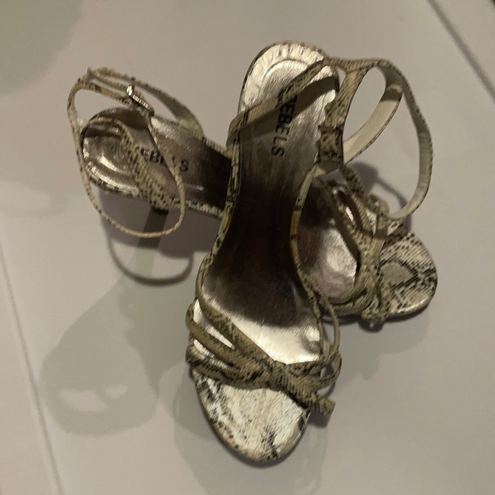 SNAKE SKIN STRAPPED HEELS...